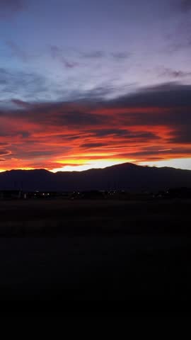 Vertical Sunset Over Pikes Peak Colorado Timelapse 4K features a particularly beautiful sunset over Pikes Peak in the Rocky Mountains shot from the foothills with slight time lapse in a vertical ratio