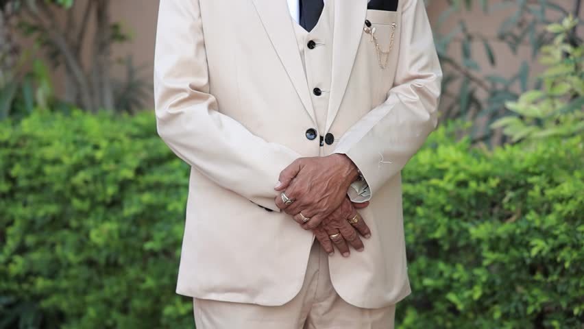 A shot of Indian adult men in a white Suit, pov of well groomed gentleman in suit Royalty-Free Stock Footage #3495141499