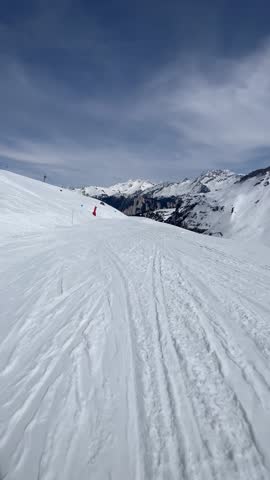 Skier on the slopes of Courchevel ski resort,French Alps. Royalty-Free Stock Footage #3495234025