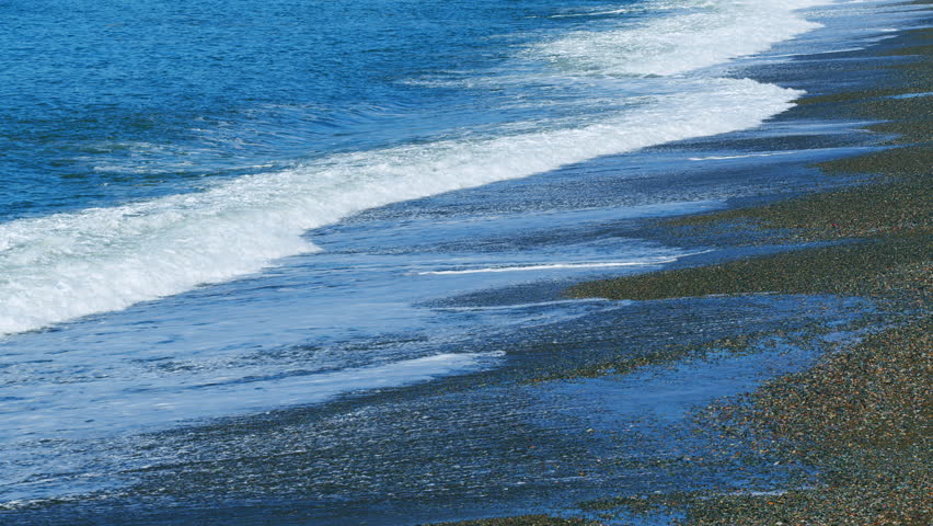 Clear Water Washes Over Pebbley And Pebble Beach. Warm Sea In Kobuleti. Adjara, Georgia. Real time.