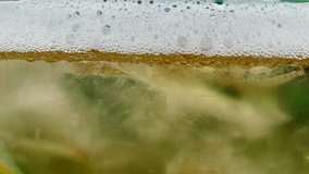 Cold Light Beer in a glass with water drops. Craft Beer close up.