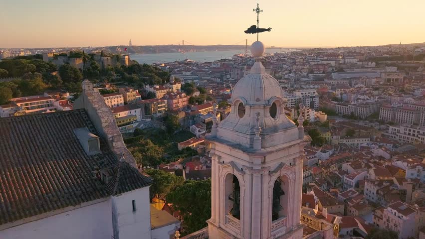 Lisbon Portugal Aerial timelapse Tower of the church Sunset sky 4k