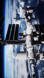 International Space Station Rotates Solar Panels In Outer Space. elements furnished by NASA