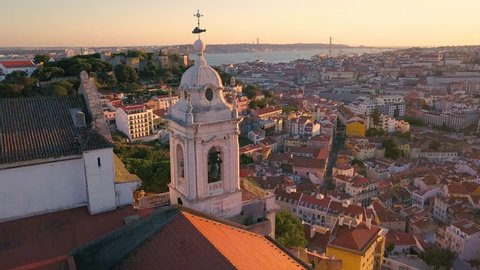 Lisbon Portugal Aerial timelapse Tower of the church Sunset sky 4k