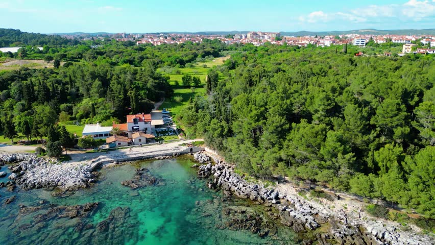 Punta Corrente Park, located near Rovinj in Istria, Croatia, offers a fantastic opportunity for riding bicycles amidst scenic natural surroundings captured by drone