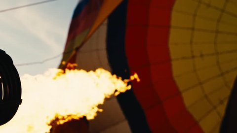 Hot air balloon. Fire bursts.