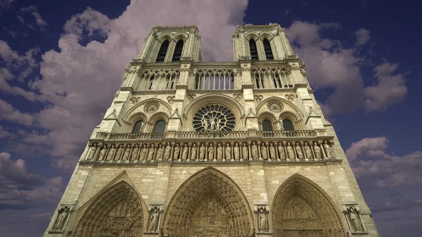 Notre Dame de Paris against the moving clouds (4K, time lapse), also known as Notre Dame Cathedral or simply Notre Dame, is a Gothic, Roman Catholic cathedral of Paris, France Royalty-Free Stock Footage #3495800103