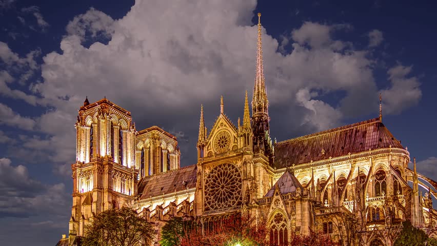 Notre Dame de Paris against the moving clouds (4K, time lapse), also known as Notre Dame Cathedral or simply Notre Dame, is a Gothic, Roman Catholic cathedral of Paris, France Royalty-Free Stock Footage #3495800175