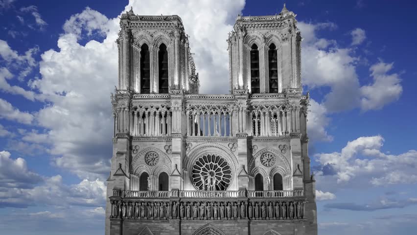 Notre Dame de Paris against the moving clouds (4K, time lapse), also known as Notre Dame Cathedral or simply Notre Dame, is a Gothic, Roman Catholic cathedral of Paris, France Royalty-Free Stock Footage #3495800213