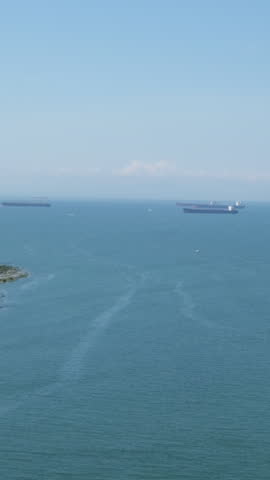 Long shot off the coast of Vancouver Island, British Columbia. View from the bridge, Vertical video