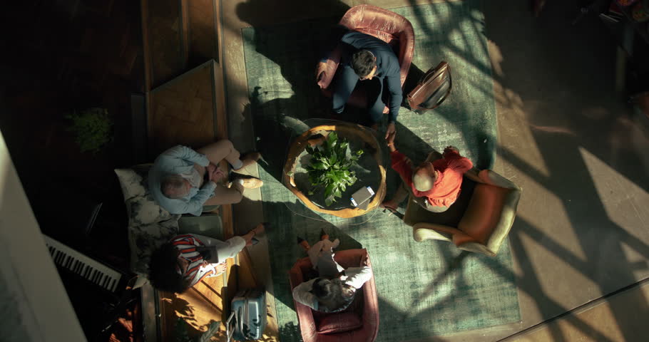 Above, meeting and business people on sofa with handshake for agreement, planning and startup. Office lobby, creative and top view of men and women for conversation, discussion and collaboration