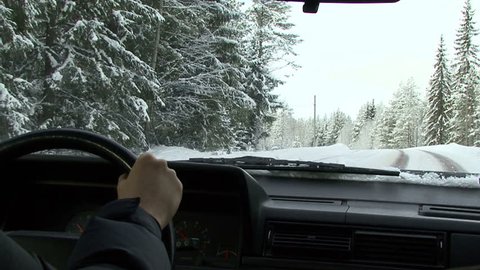 driving on country road in the snow,