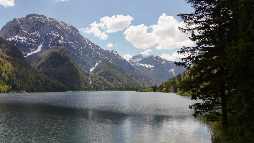 AERIAL Beautiful mountain lake with mountains at the background