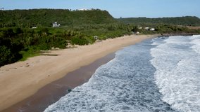 Beautiful beach waves in a tropical country_drone shot