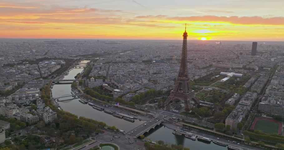 Beautiful view of famous Eiffel Tower in France with colorful twilight romantic sky. Wide establishing aerial morning sunrise or sunset of paris city center best travel destinations landmark in Europe