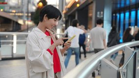 Young Asian woman using a smart phone in modern city. - Powered by Shutterstock - Get 15% off with code: PIKWIZARD15