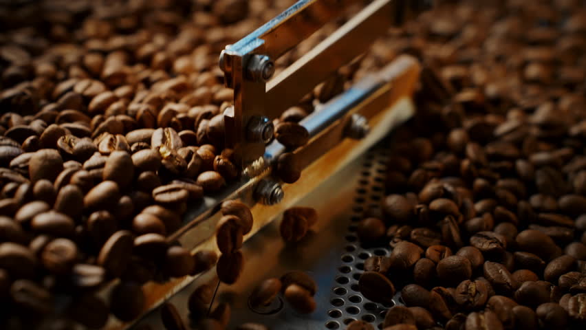 Close up of coffee beans in roaster. High quality 4k footage