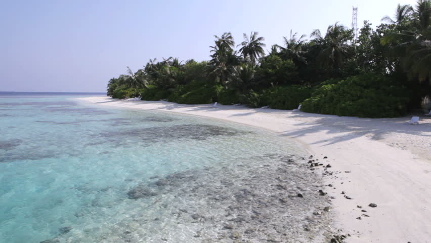 Maldives - shallow coral waters and beach, HD