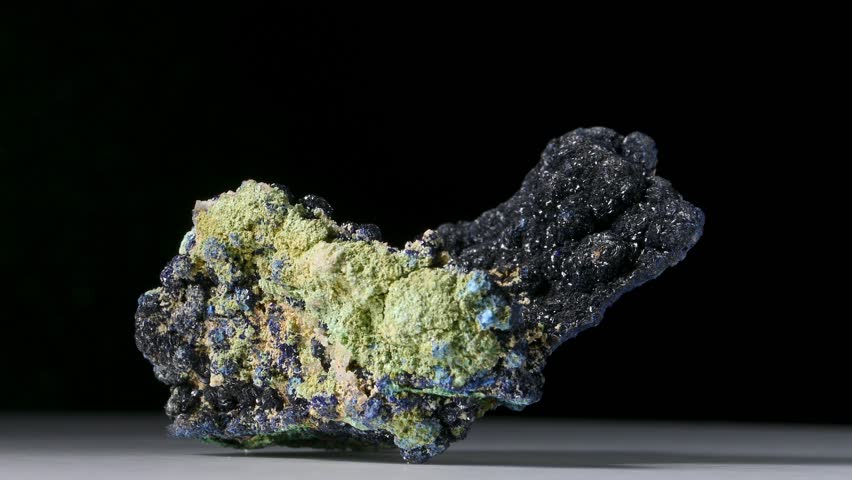 Azurite (blue) and Malachite (green) on matrix (from Zacatecas, Mexico) rotating against a black background