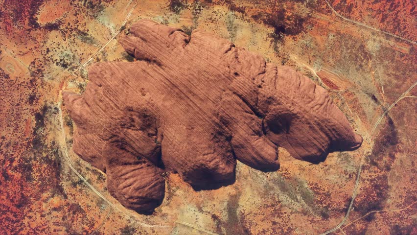 Aerial top down view of Uluru also known as Ayers Rock is a large sandstone monolith near the centre of Australia listed as a UNESCO World Heritage Site and popular tourist destination 4k animation Royalty-Free Stock Footage #3496451931