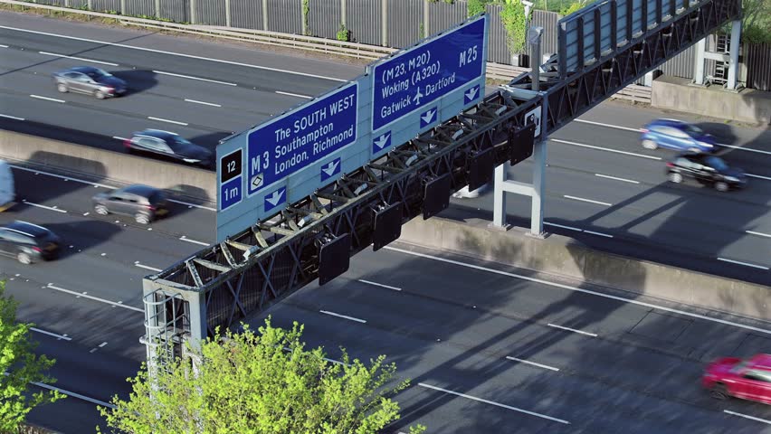M25 Motorway Overhead Gantry and Traffic Flow Royalty-Free Stock Footage #3496595973