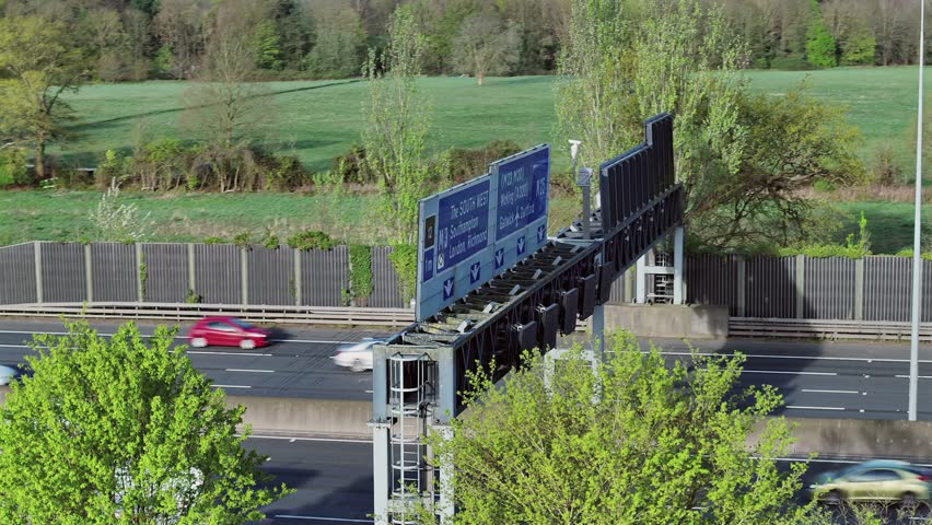 M25 Motorway Overhead Gantry and Traffic Flow Royalty-Free Stock Footage #3496597167
