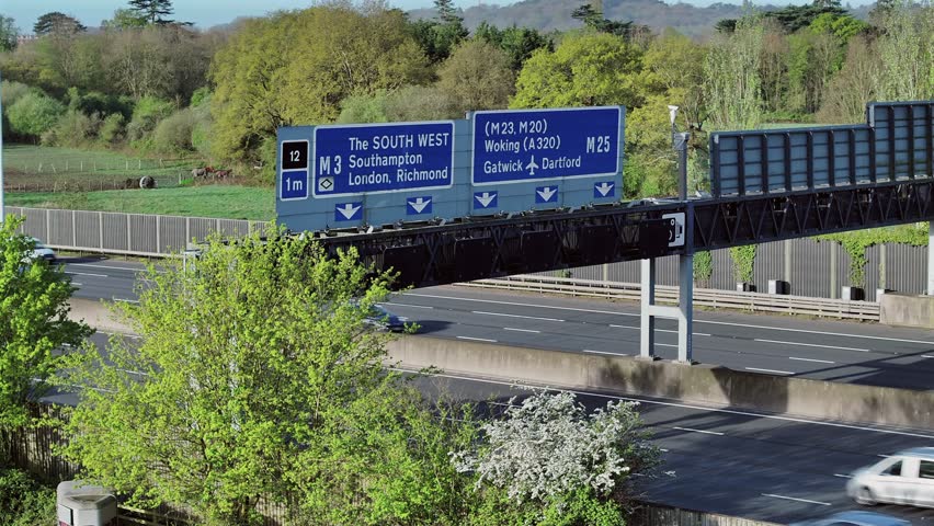 M25 Motorway Overhead Gantry and Traffic Flow Royalty-Free Stock Footage #3496598631