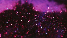 Neon glitter texture. Shiny sequin. Bokeh light. Defocused bright pink red blue black color shimmering circles fluid flow cascade motion dark abstract art background. - Powered by Shutterstock - Get 15% off with code: PIKWIZARD15
