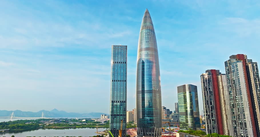 Commercial buildings and natural scenery on sunny day in Shenzhen city
