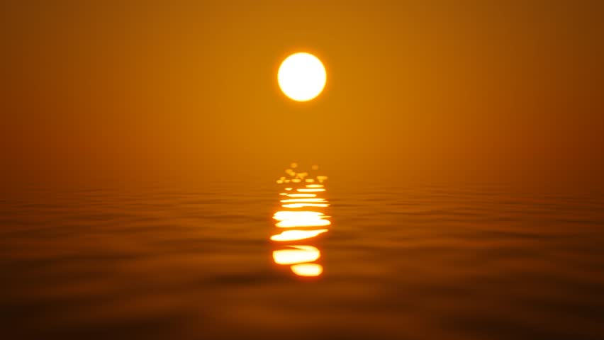 Beautiful sunset over the calm surface of the ocean.