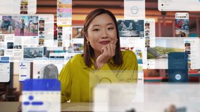 Dynamic Portrait with an Asian Woman Engaging in Online Shopping and Content Creation at Her Home Office. Camera Fluidly Moves Around Her, Capturing Her Interactions With Multiple Digital Screens - Powered by Shutterstock - Get 15% off with code: PIKWIZARD15