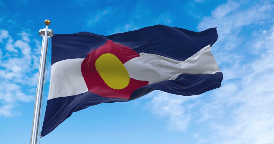 Flag of Colorado realistic waving in the wind with sky background (Perfect Loop)