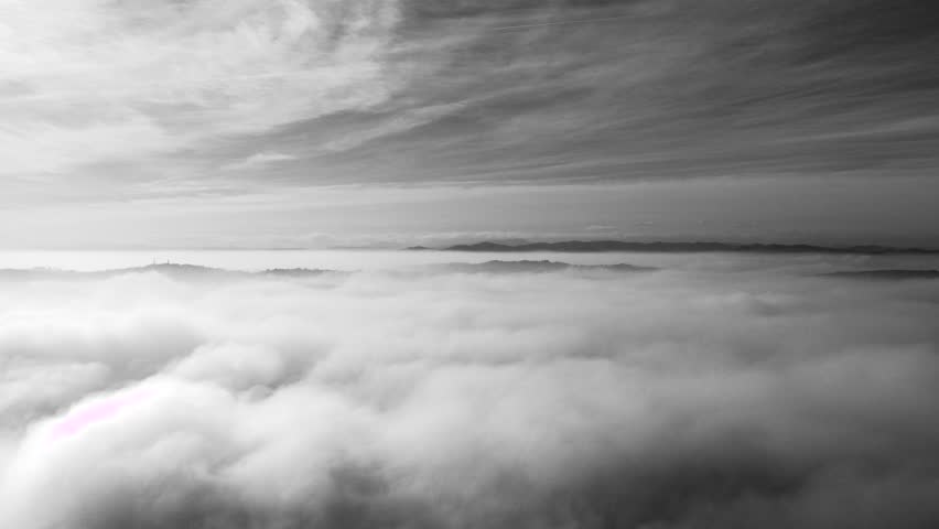 Italy, January 2018 - footage whit drone DJI. Above the clouds of the city of Pesaro with a hint of sinister left. The hills of the hinterland can also be glimpsed