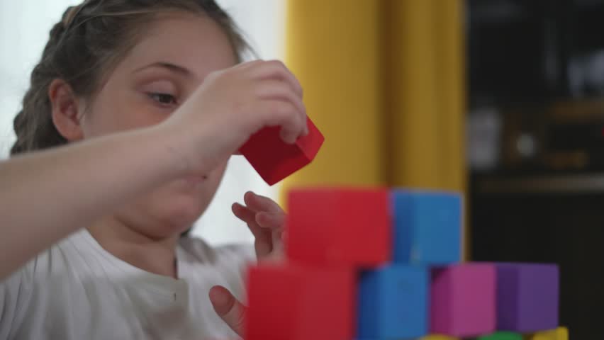 Happy child at kindergarten with constructor blocks building skillfully. Joy constructive play learning with shapes and colors. Cheerful kindergarten moments child play with constructor. child dream.