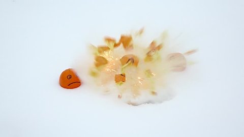 Three faces on orange fruits, two frowning and one with smile, middle explode and fly asunder, slow motion shot. Funny and crazy one depart by blowing up, disappear and leaving smoky crater on ground
