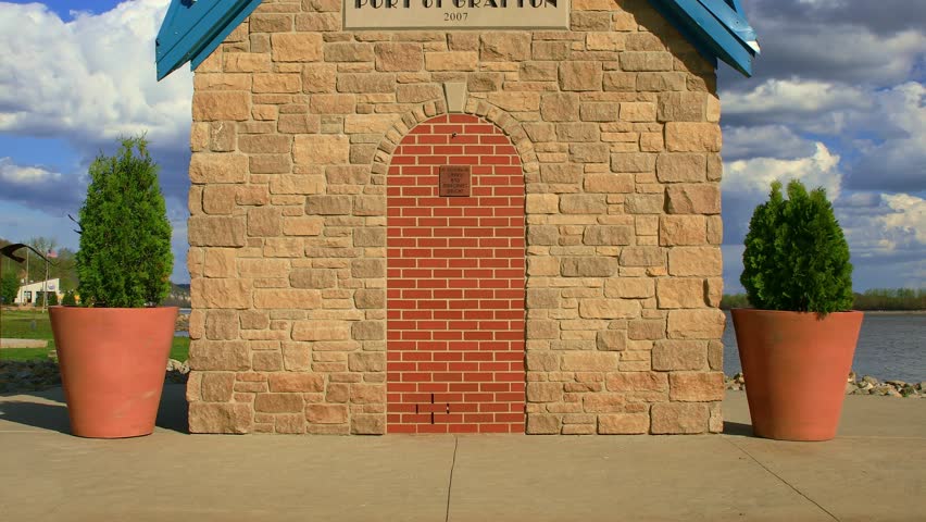 Port Of Grafton Lighthouse Panning Up with Blue Skies with Clouds, Illinois, USA.
