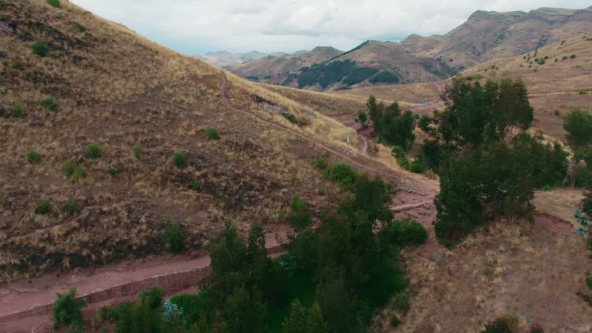 Travelers trekking on an old Inca road leading to Huanacaure, the birthplace of Cuzco