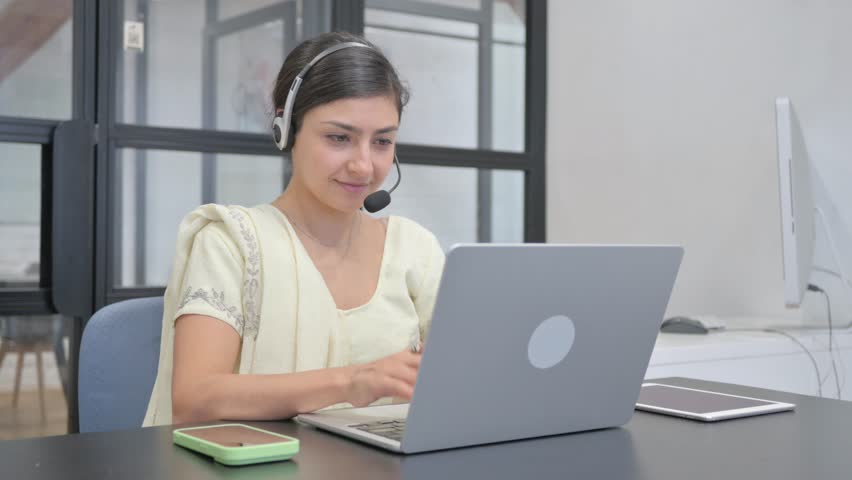 Indian Woman with Headset Smiling at Camera in Call Center Royalty-Free Stock Footage #3497085003