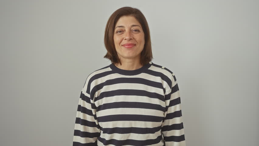 Madly excited hispanic woman, in striped sweater, celebrating her wild win in triumph. arms raised in victory over white isolated background. Royalty-Free Stock Footage #3497158367
