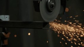 Craftsman working with grinder at industrial plant, man cutting piece of iron pipe, sparks flying around at workshop. Close up shot. - Powered by Shutterstock - Get 15% off with code: PIKWIZARD15