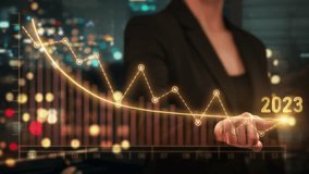 Economic Recession Graphs and Stock Markets Showing a Global Crisis. Effects of Inflation, War, Epidemics. Young Female Financial Broker Using Virtual Reality to Draw a Descending Chart. AR 2023. - Powered by Shutterstock - Get 15% off with code: PIKWIZARD15