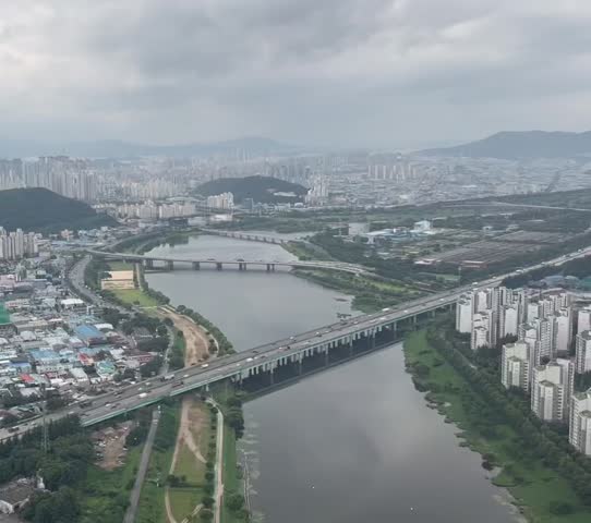 Landing to Busan Airport, South Korea, Asia with the view of cityscape along with buildings and river loop