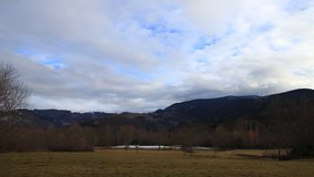 Pyrenean landscape with moving clouds filmed in timelapse, Occitania in south of France
