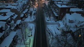 Historic street in American city in New England during winter night with snow. Aerial tilt up reveal. - Powered by Shutterstock - Get 15% off with code: PIKWIZARD15