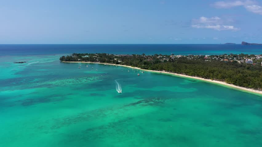 Mauritius beach aerial view of Mont Choisy beach in Grand Baie, Pereybere North. Mont Choisy, public beach in Mauritius island, Africa. Beautiful beach of Mont Choisy in Mauritius, drone aerial view.