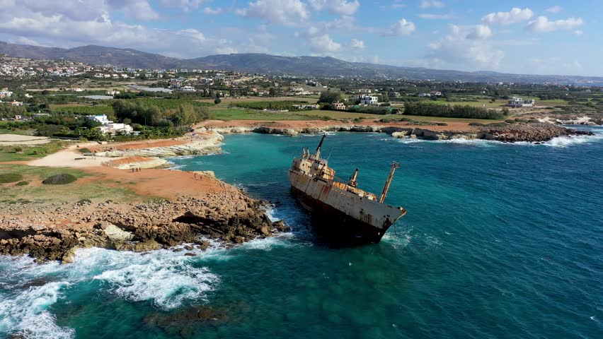 Abandoned Edro III Shipwreck at seashore of Peyia, near Paphos, Cyprus. Historic Edro III Shipwreck site on the shore of the water in Cyprus. Aerial view of Shipwreck EDRO III, Pegeia, Paphos.