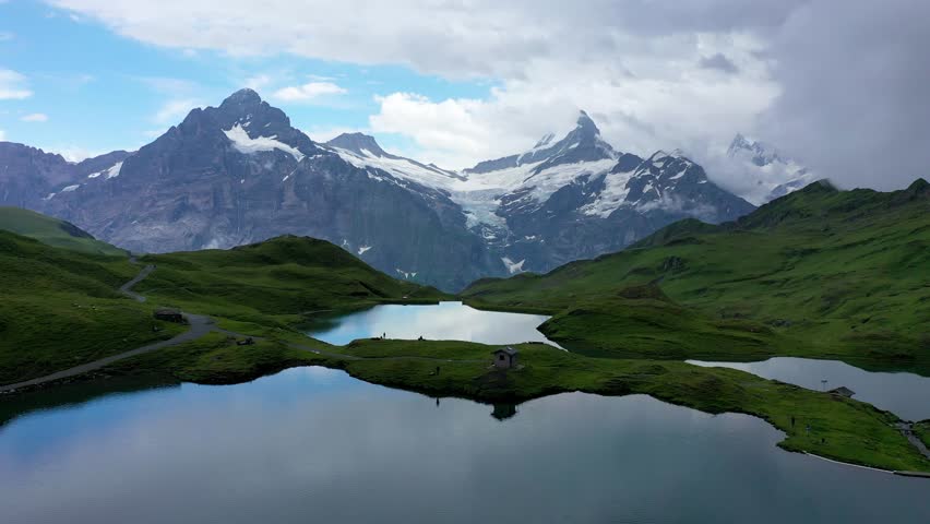 Bachalpsee lake at dawn, Bernese Oberland, Switzerland. Alpine view of the Mt. Schreckhorn and Wetterhorn. Location Bachalpsee in Swiss alps, Grindelwald valley, Interlaken, Europe, Switzerland.