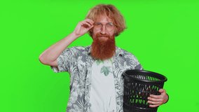 Redhead man taking off throwing out glasses into bin after medical vision laser treatment therapy surgery looking smiling at camera, heal, cure. Handsome guy isolated on green chroma key background - Powered by Shutterstock - Get 15% off with code: PIKWIZARD15