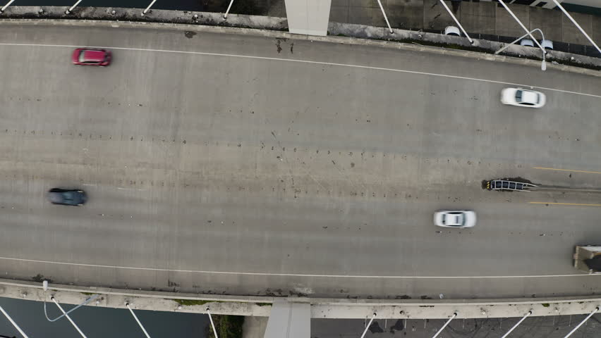 Vehicles Driving Over East 21st Street Bridge Spanning The Foss Waterway in Tacoma, Washington. - aerial ascend shot