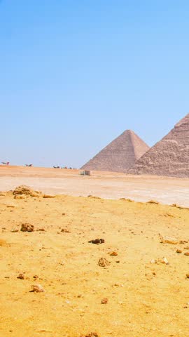 full HD 1080 Vertical video footage, Archeology reels, Seven Wonders of the World. Great Pyramids of Giza, panoramic 3 Pyramids view, selective focus with shallow depth of field.  Cairo Egypt